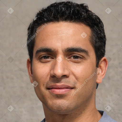 Joyful white young-adult male with short  black hair and brown eyes