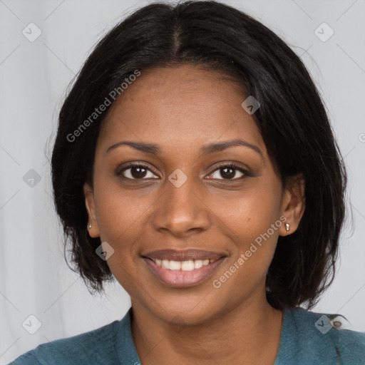 Joyful black young-adult female with long  black hair and brown eyes