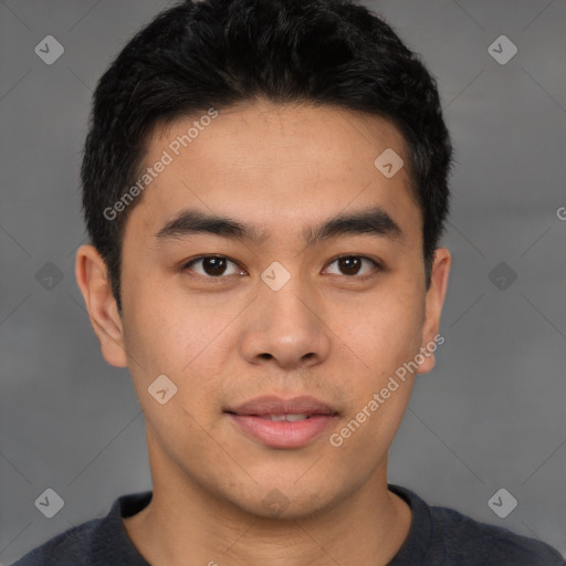 Joyful latino young-adult male with short  brown hair and brown eyes