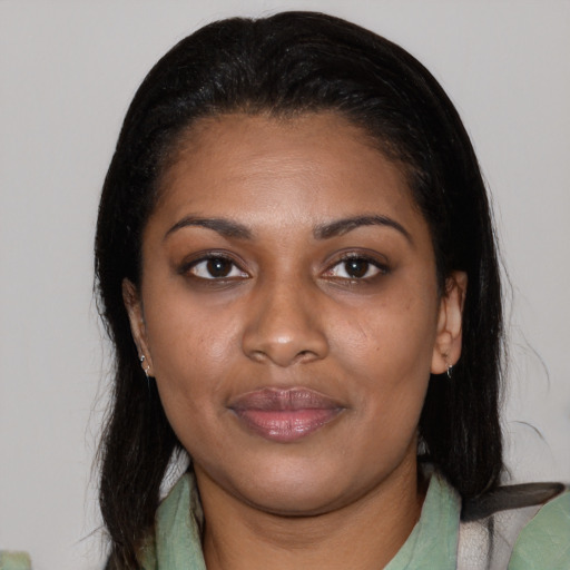 Joyful latino young-adult female with medium  black hair and brown eyes