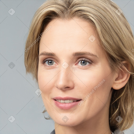 Joyful white young-adult female with medium  brown hair and blue eyes