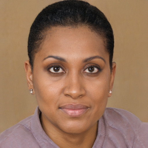 Joyful black young-adult female with short  brown hair and brown eyes