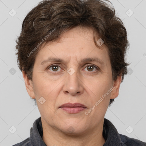 Joyful white adult female with short  brown hair and grey eyes