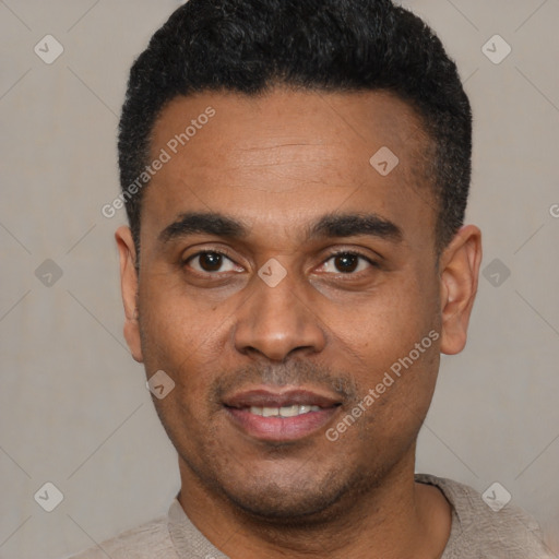 Joyful black young-adult male with short  black hair and brown eyes