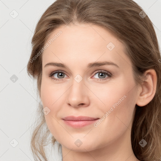 Joyful white young-adult female with long  brown hair and grey eyes