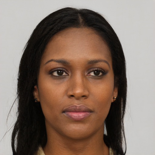 Neutral black young-adult female with long  brown hair and brown eyes