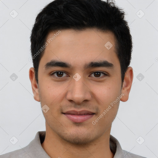Joyful asian young-adult male with short  black hair and brown eyes