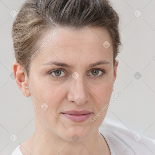 Joyful white adult female with short  brown hair and grey eyes