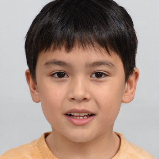 Joyful white child male with short  brown hair and brown eyes