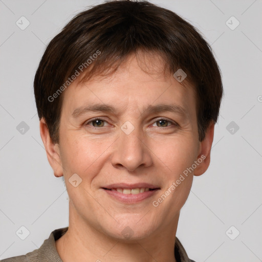 Joyful white adult male with short  brown hair and grey eyes