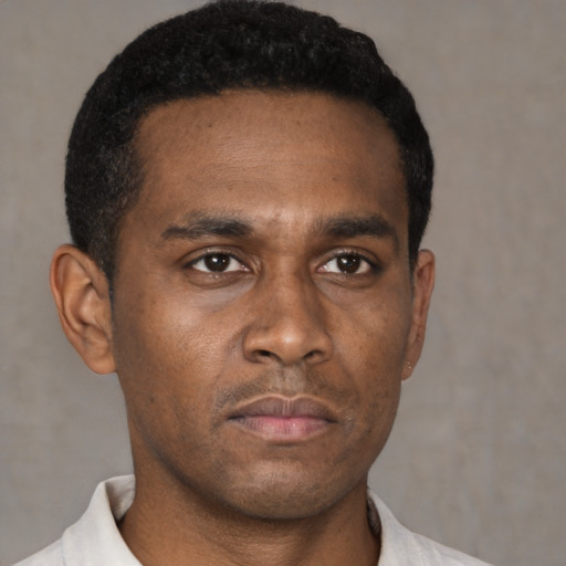 Neutral black young-adult male with short  black hair and brown eyes