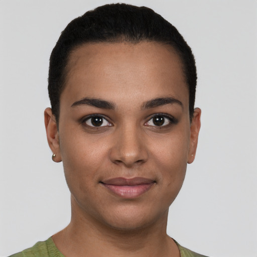 Joyful latino young-adult female with short  brown hair and brown eyes