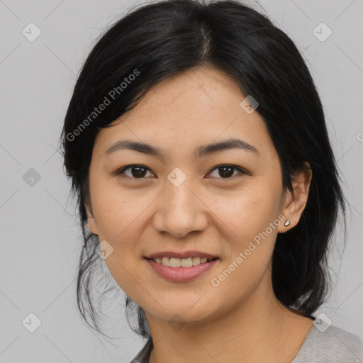 Joyful asian young-adult female with medium  black hair and brown eyes