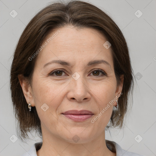 Joyful white adult female with medium  brown hair and brown eyes