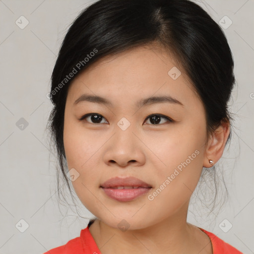 Joyful asian young-adult female with medium  black hair and brown eyes