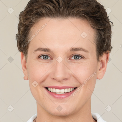 Joyful white young-adult female with short  brown hair and grey eyes