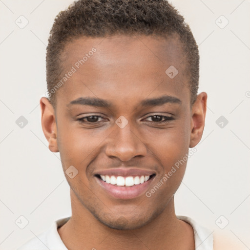 Joyful black young-adult male with short  brown hair and brown eyes