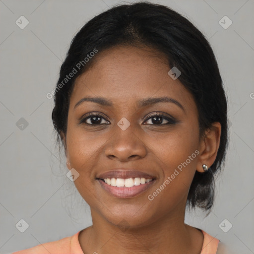 Joyful black young-adult female with medium  brown hair and brown eyes