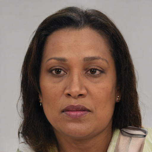 Joyful white adult female with medium  brown hair and brown eyes
