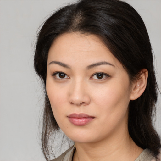 Neutral asian young-adult female with medium  brown hair and brown eyes