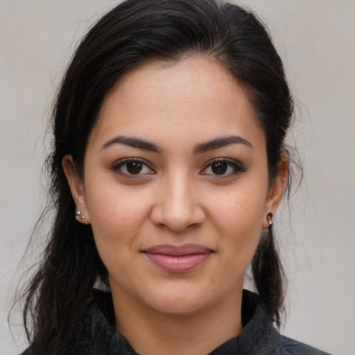 Joyful latino young-adult female with medium  brown hair and brown eyes