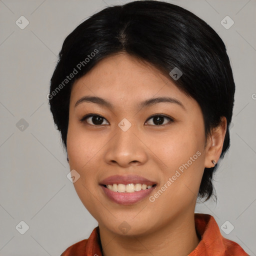 Joyful asian young-adult female with medium  black hair and brown eyes