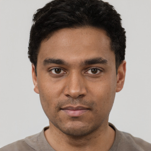 Neutral black young-adult male with short  black hair and brown eyes