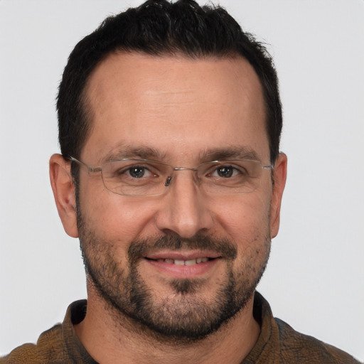 Joyful white adult male with short  brown hair and brown eyes