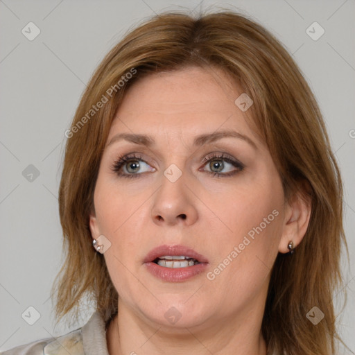 Joyful white adult female with medium  brown hair and grey eyes