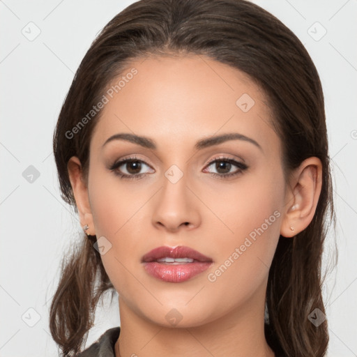 Neutral white young-adult female with long  brown hair and brown eyes