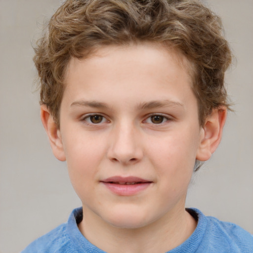 Joyful white child male with short  brown hair and brown eyes