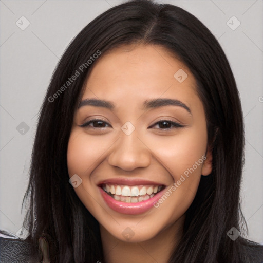 Joyful latino young-adult female with long  black hair and brown eyes