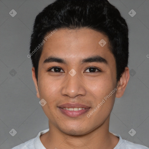 Joyful asian young-adult male with short  black hair and brown eyes