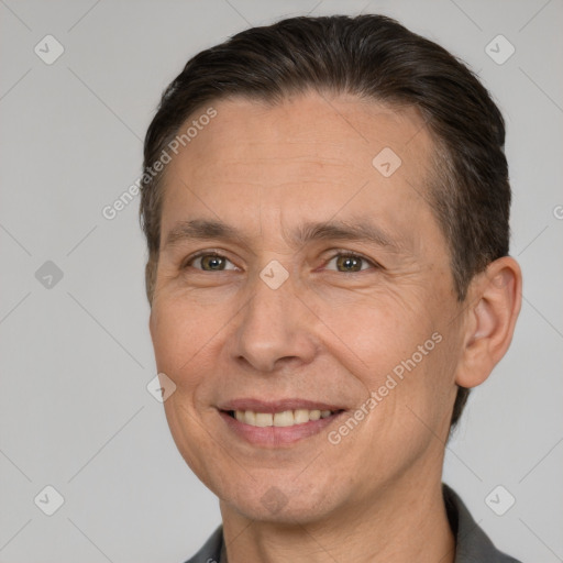 Joyful white adult male with short  brown hair and brown eyes