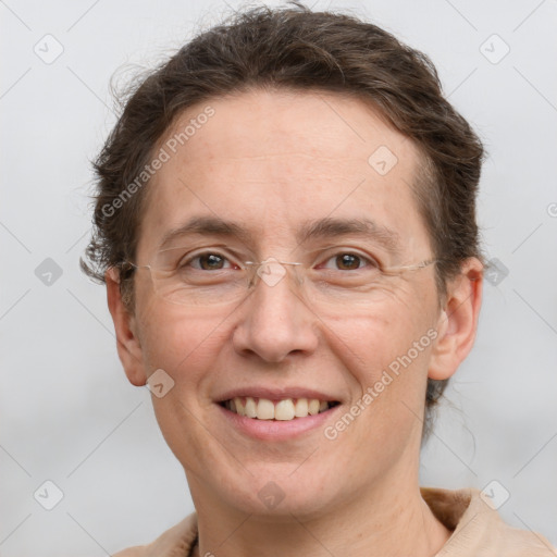 Joyful white adult female with short  brown hair and grey eyes