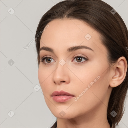 Neutral white young-adult female with long  brown hair and brown eyes