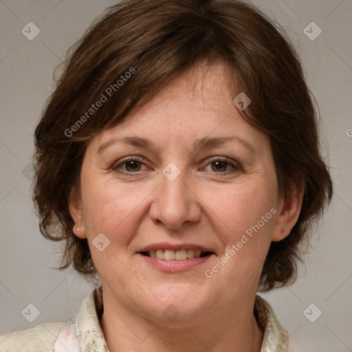 Joyful white adult female with medium  brown hair and grey eyes