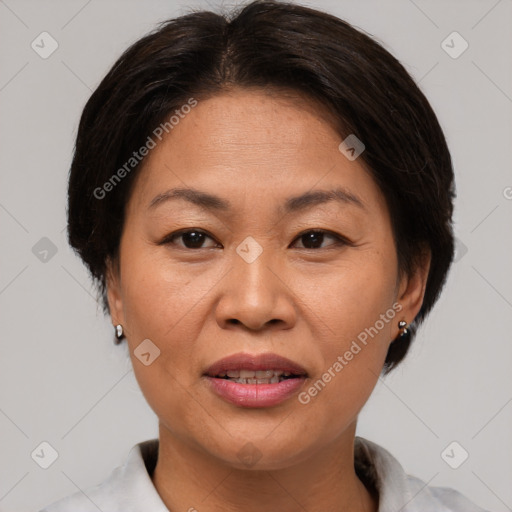 Joyful asian adult female with short  brown hair and brown eyes