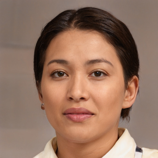 Joyful asian young-adult female with medium  brown hair and brown eyes