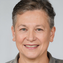 Joyful white middle-aged female with short  brown hair and brown eyes