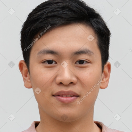 Joyful asian young-adult male with short  brown hair and brown eyes