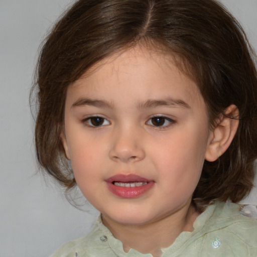 Joyful white child female with medium  brown hair and brown eyes