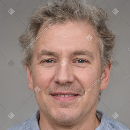 Joyful white adult male with short  brown hair and grey eyes