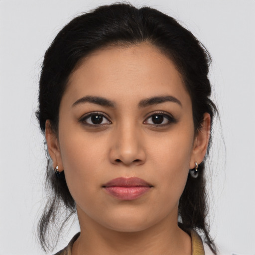 Neutral latino young-adult female with long  brown hair and brown eyes
