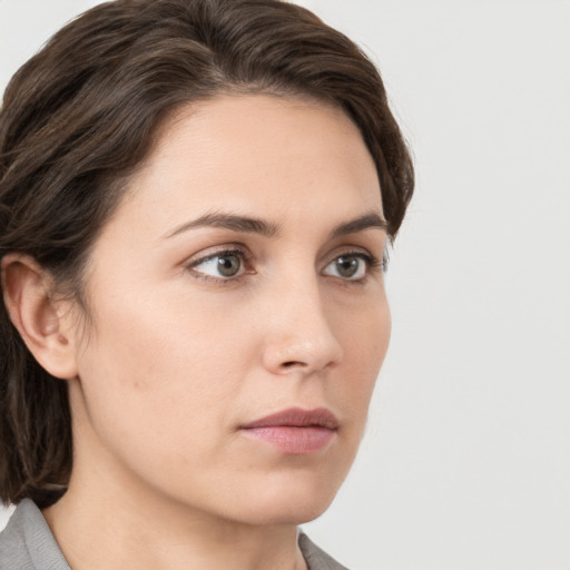 Neutral white young-adult female with medium  brown hair and grey eyes