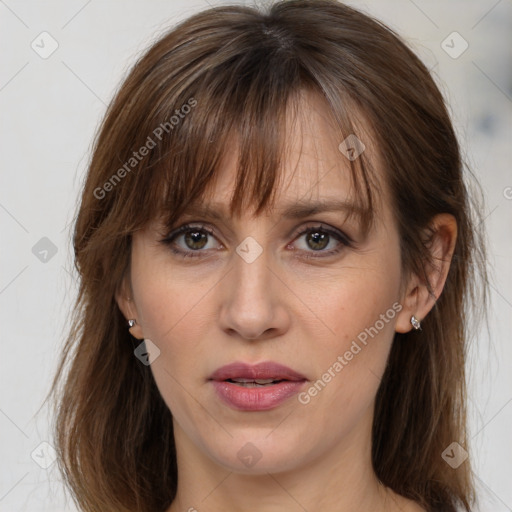 Joyful white adult female with medium  brown hair and grey eyes