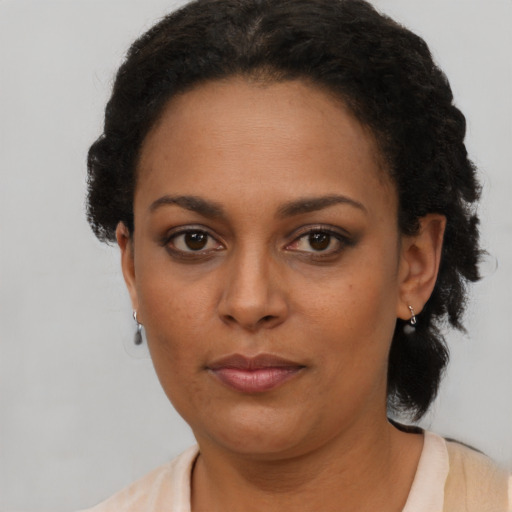 Neutral black adult female with short  brown hair and brown eyes