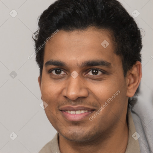 Joyful latino young-adult male with short  brown hair and brown eyes