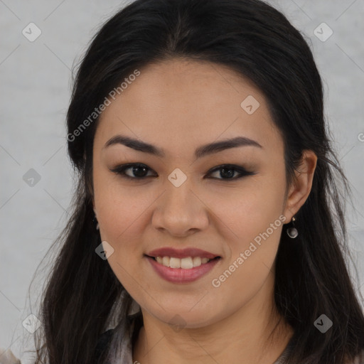 Joyful asian young-adult female with long  brown hair and brown eyes