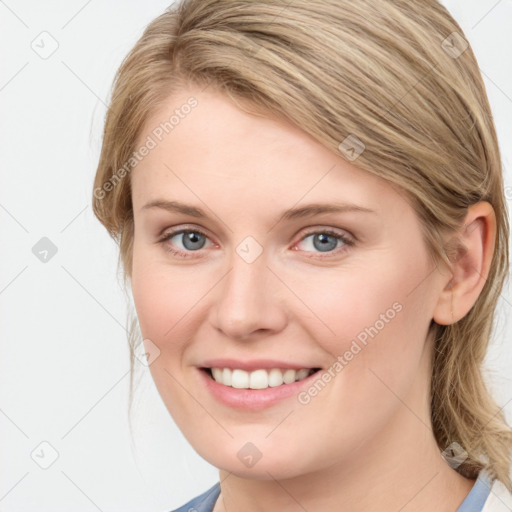 Joyful white young-adult female with medium  brown hair and blue eyes